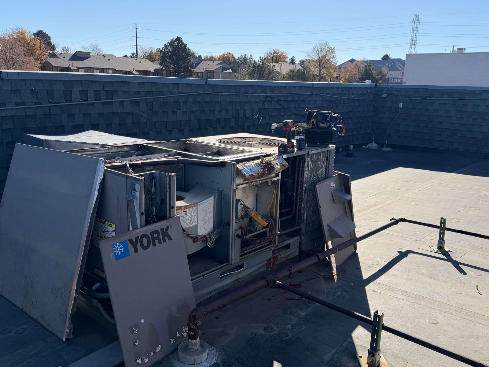 Residential furnace repair technician fixing heating system in Littleton Colorado